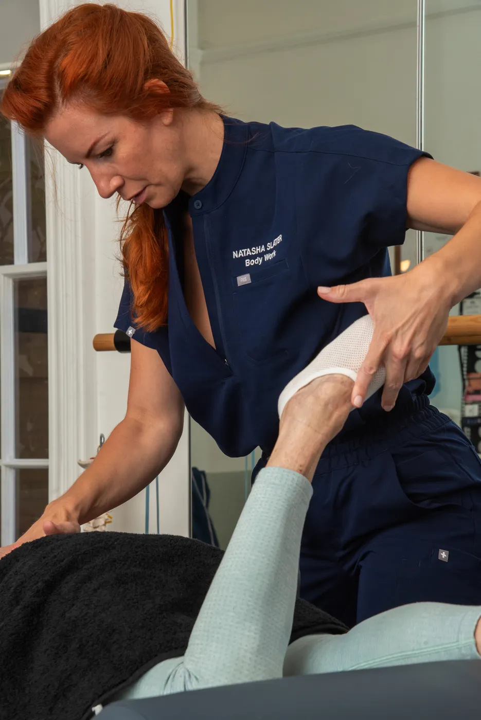 Therapist delivering hands-on mobility and recovery treatment at Meridian, Southampton